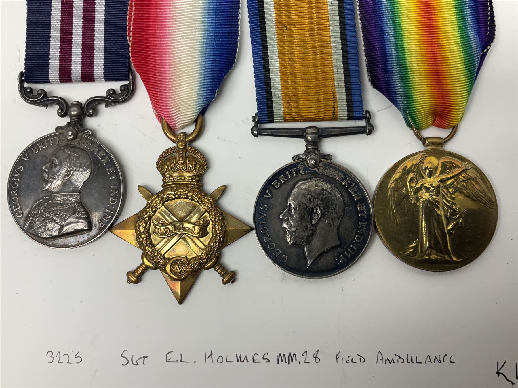 WW1 Military Medal KIA group of four comprising MM, British War Medal, 1914-15 Star and Victory Medal awarded to 32225 Pte. (later A.Sjt.) E.L. Holmes R.A.M.C., the MM inscribed 28F/A R.A.M.C.; all with ribbons; together with photocopied research material including newspaper article with presentation photograph, CWGC certificate,  London Gazette entry etc