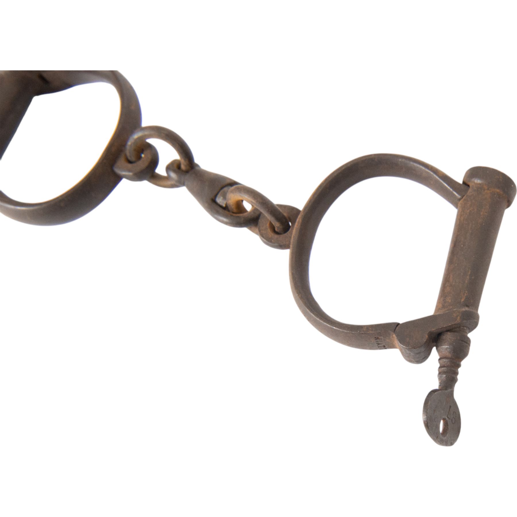 Set of No.8 Hiatt warranted wrought police handcuffs with key, together with another set of shackles, marked hard 
