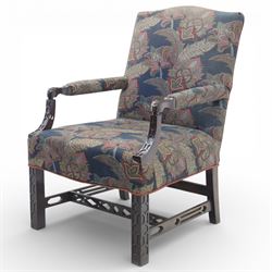 Early 20th century Chippendale revival Gainsborough elbow chair, rectangular upholstered back and seat covered in foliate patterned fabric, with open arms carved to the terminals and supports with pierced and geometric detail, raised on square section legs with blind fretwork panels