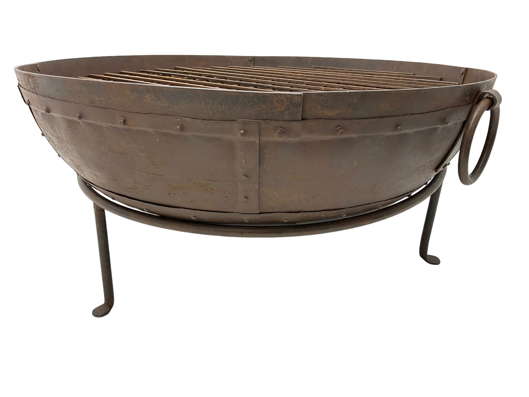 Circular riveted iron fire pit, strapwork sides with twin handles on stand, with grate