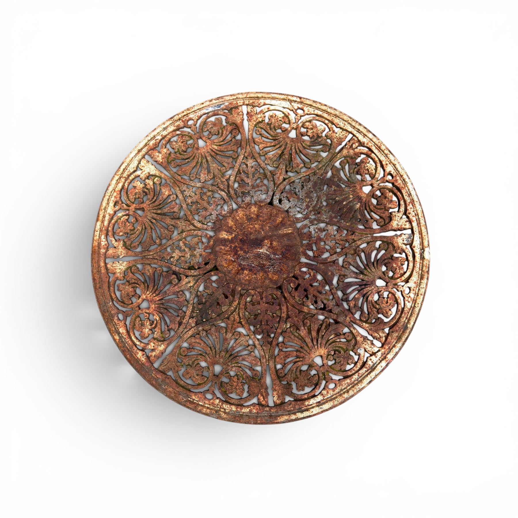Victorian cast iron garden table, circular pierced top with foliate and scroll decoration, raised on an ornate tripod base with natural weathered paint finish.