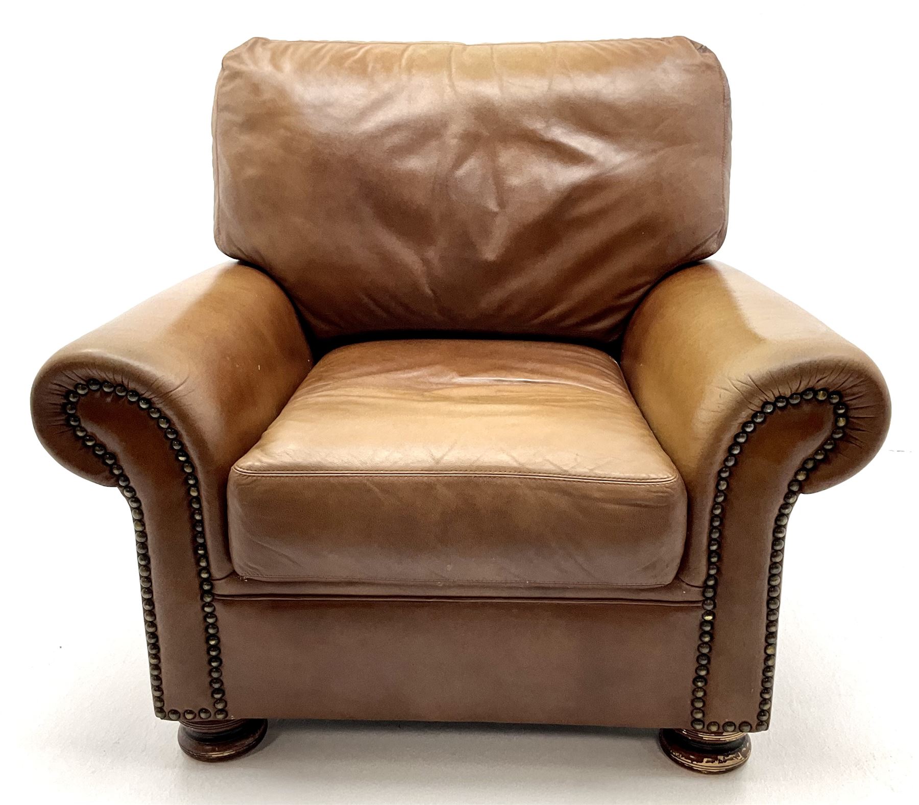 Three seat studded tan leather sofa, scrolling arms, turned supports (W190cm) with matching two seat (W155cm) armchair (W100cm) and footstool 