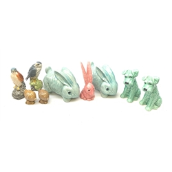 Two Sylvac Terrier dog figurines, each marked beneath and numbered 1379, a pink Sylvac rabbit, and two later Sylvac rabbits, together with two Beswick Beneagles decanters, Kestre and Merlin, and two smaller Beswick Beneagles decanters. 