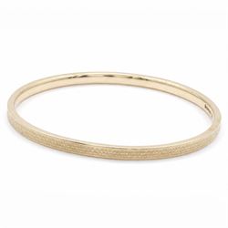 Early 20th century 9ct gold arm bangle, with engine turned decoration by Deakin & Francis Ltd, Birmingham 1922
