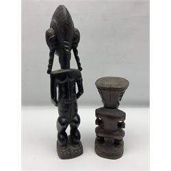 Carved african figures, together with a polynesian figure, largest H38cm
