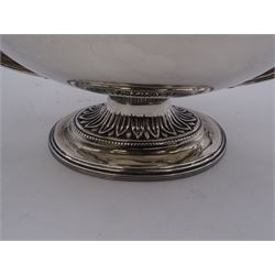 Edwardian twin handled sucrier, of plain oval form, the lid with embossed sugar cane leaves and urn shaped finial, upon conforming stepped foot, hallmarked Birmingham 1901, maker's mark worn and indistinct