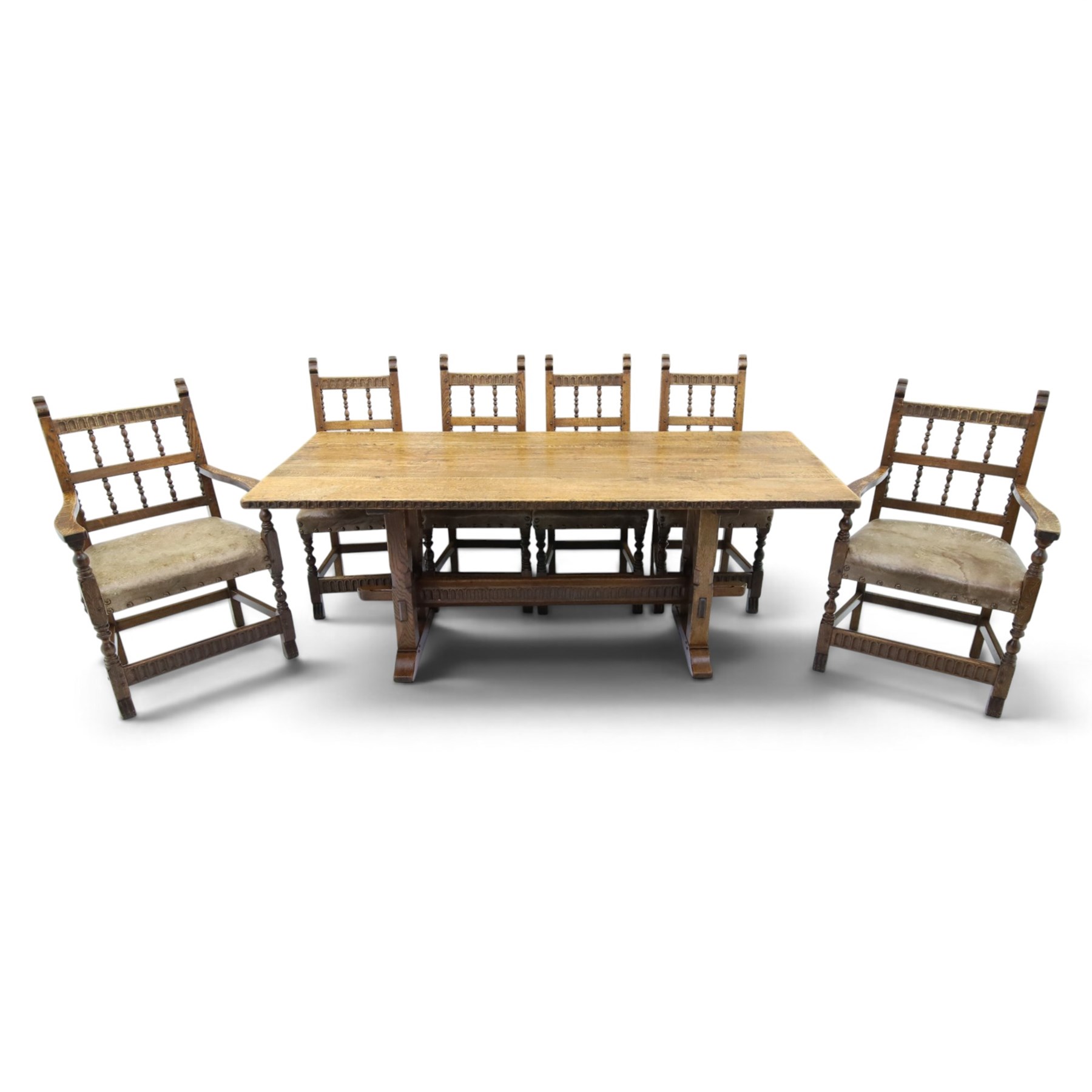 Rupert Griffiths for Monastic Woodcraft - oak 6ft refectory dining table with set six (4+2) matching chairs, rectangular top with arcaded frieze, with trestle base with further arcaded carved stretchers, chairs with carved rails and finials, leather wrapped seats with stud detail, turned supports united by carved stretcher