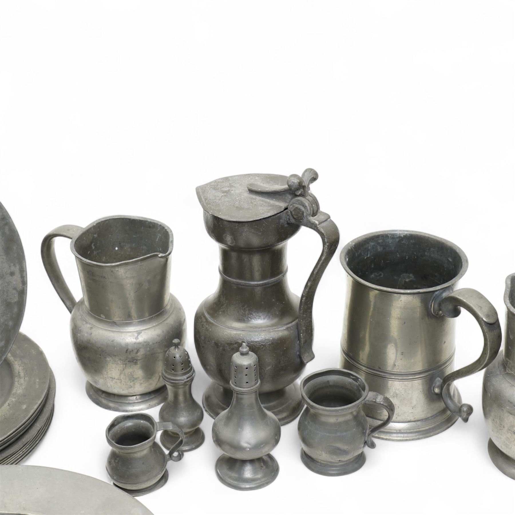 Large collection of 18th century and later pewter plates, of graduating sizes, and a group of tankards, various touch marks and impressions