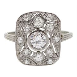 Platinum Art Deco style diamond panel ring, the rectangular curved pierced panel with a central round brilliant cut diamond of approx 0.25 carat and diamond surround, stamped Plat, total diamond weight approx 0.50 carat