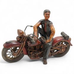 Painted resin model of a figure on a Harley Davidson motorbike, W50cm
