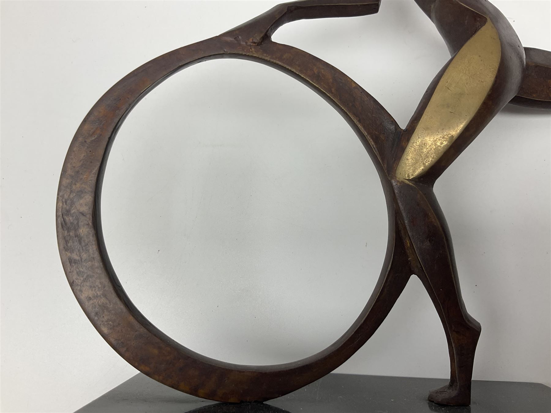 John Huggins FRBS (British 1938): 'Girl with Hoop', bronze sculpture upon black lacquered wooden base, H33cm, artist resale rights apply