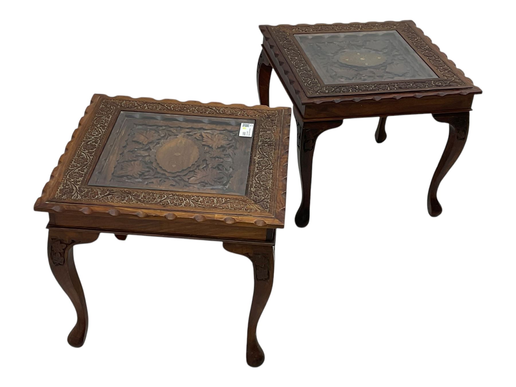 Pair of Pakistan carved hardwood brass inlaid lamp tables, square form, cabriole legs, inset glass tops