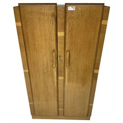 Early 20th century Art Deco period oak Gentleman's wardrobe, the interior fitted with shelves, hanging rails and two long drawers