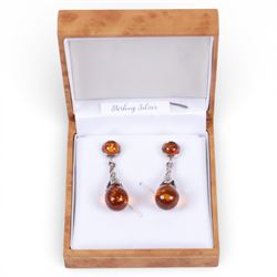 Pair of silver Baltic amber pendant stud earrings, boxed