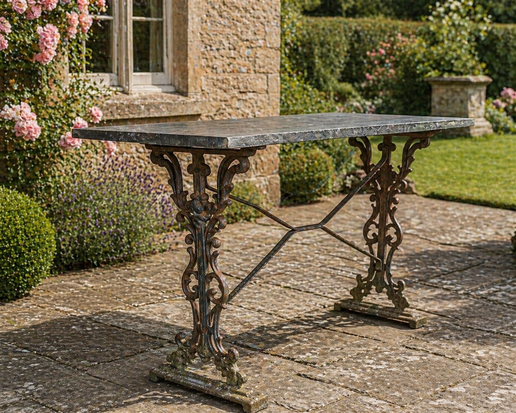 Edwardian ornate cast iron garden table, later rectangular granite top
