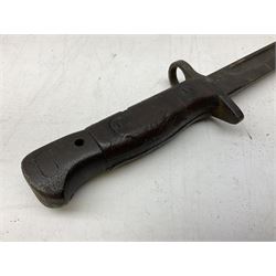 British Pattern 1907 bayonet with 43.5cm fullered steel blade; in leather scabbard with webbing frog L58cm overall; another Pattern 1907 bayonet lacking scabbard; and British Pattern 1888 Mk.I bayonet by Wilkinson London (no scabbard) (3)