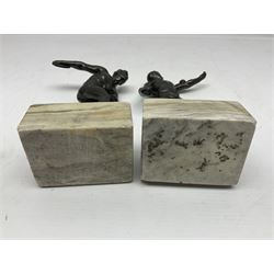 Bronzed model of the discus thrower and another of a episkyros player, both raised upon retangular plinths, H18cm