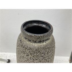 Two smooth polished ram horn handled Shepherd's crooks and a further similar example, together with various shooting sticks, walking sticks and canes, housed in a volcanic lava glaze West German style vase