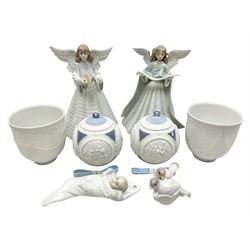 Four Lladro figures, comprising Angelic Cymbalist no 5875, Angel Tree Topper no 5875, Baby's First Christmas no 6037, First Christmas Together no 5923, together with two 1988 Christmas Balls 1988 no 1603, and two candle holders Dolphins at Play no 17666, Sail the Seas no 17665, all with original boxes, largest example H18cm