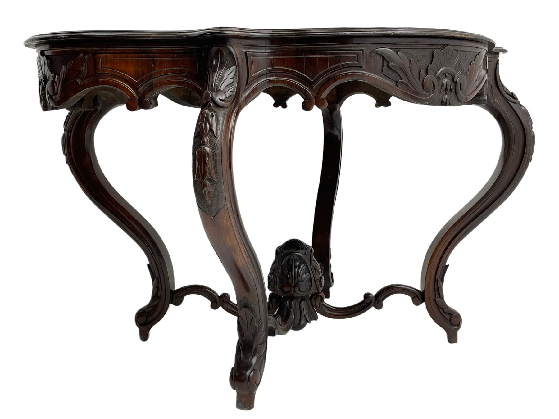 19th century Irish rosewood centre table, the shaped and moulded top over shaped apron carved with scrolled foliage, on serpentine supports carved with bell flowers, the supports united by anthemion carved finial and s-scroll x-framed stretchers