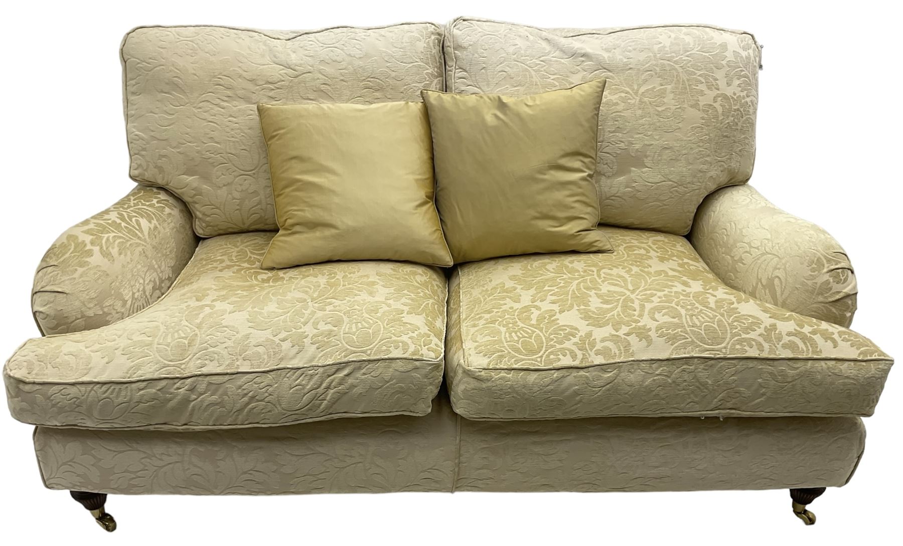 Multi-York - Howard shape two-seat sofa, upholstered in scrolling floral pattern loose covers, rolled arms, on turned front feet with brass cups and castors