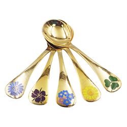 Five Danish silver-gilt year spoons by Georg Jensen, each decorated with different floral motif including sunflower, forget-me-not and shamrock, dated between 1973 and 1983, each impressed on underside RA AB, Sterling Denmark, and marked for Georg Jensen, approximate gross weight 7.3ozt (227 grams)