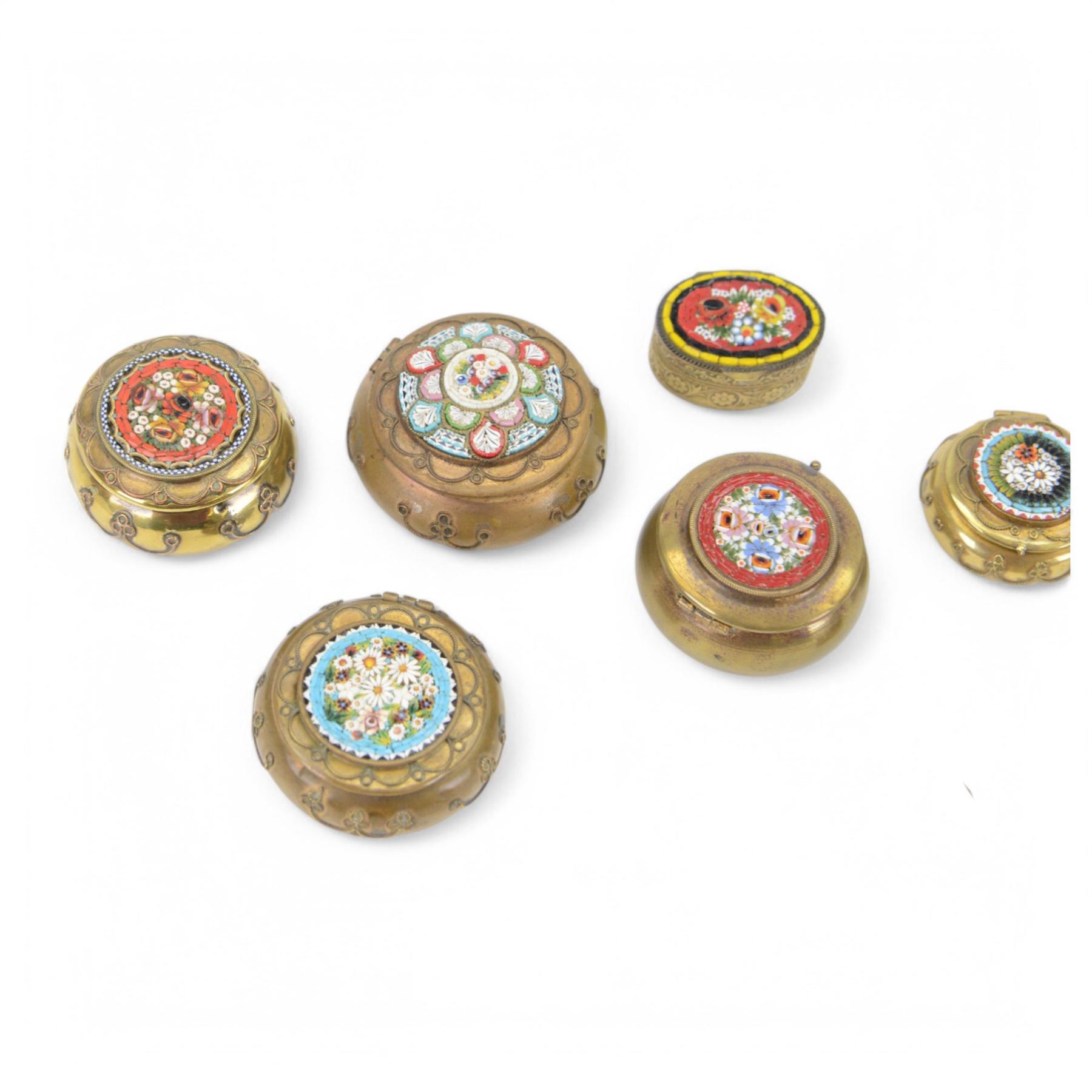 Eight micro mosaic pill boxes, the hinged lids decorated with floral designs  
