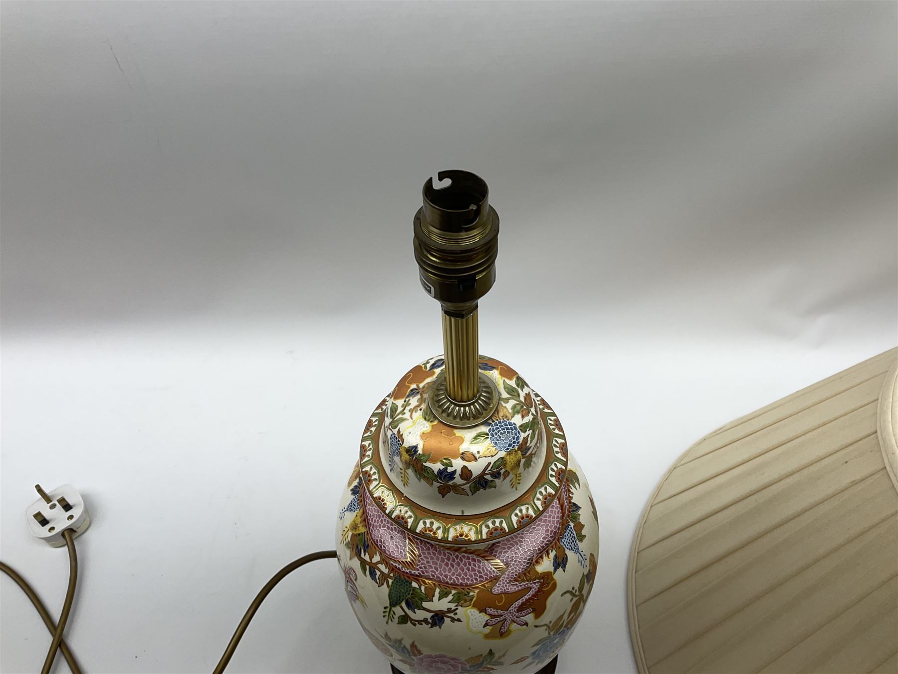 Table lamp of baluster form, decorated in the Oriental style with phoenix and dragon amidst blossoming flowers, with plated cream fabric shade, lamp base not including fixtures H35cm