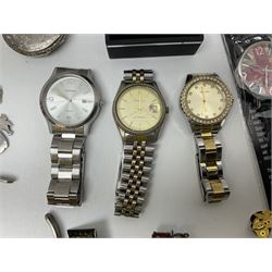 Three Sekonda wristwatches, together with other wristwatches, enamel badges and collectable badges