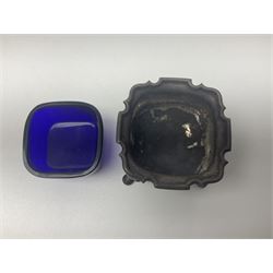 Modern two piece silver cruet set, comprising pepper shaker and open salt, each with shaped rims and upon four pad feet, hallmarked William Suckling Ltd, Birmingham 1962, together with an early 20th century silver open salt, of oval form, hallmarked William Aitken, Birmingham 1918