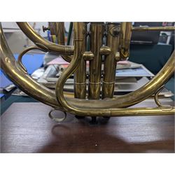 Boosey & Co Ltd French horn, converted into a table lamp, upon a wooden plinth, H45cm