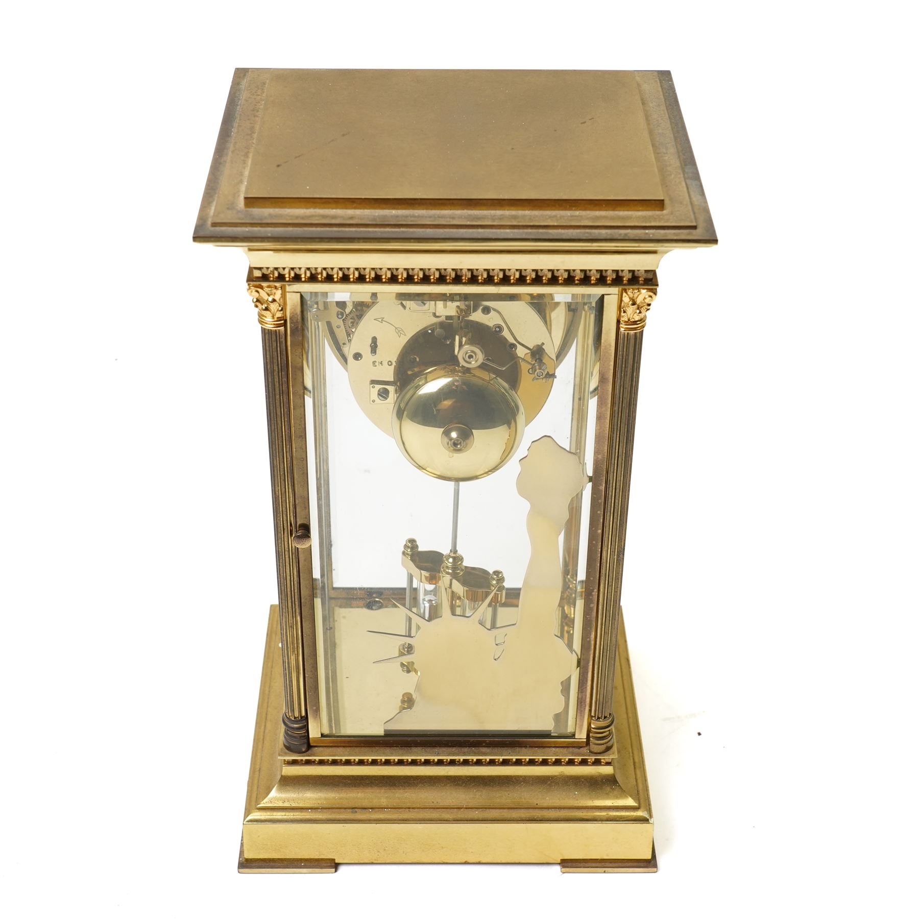 American-20th century Franklin Mint  8-day four-glass mantle clock, brass case with bevelled glass to the doors and sides, with reeded columns and Corinthian capitals to the corners, enamel dial with Roman numerals and five minute Arabic's, with steel moon hands and visible jewelled Brocot escapement, Dial inscribed L' Epee, Liberty Clock, Franklin Mint. No 0906 , with a twin file mercury pendulum and brass silhouette depiction of the Statue of Liberty to the rear of the case, twin train going barrel movement with rack striking.