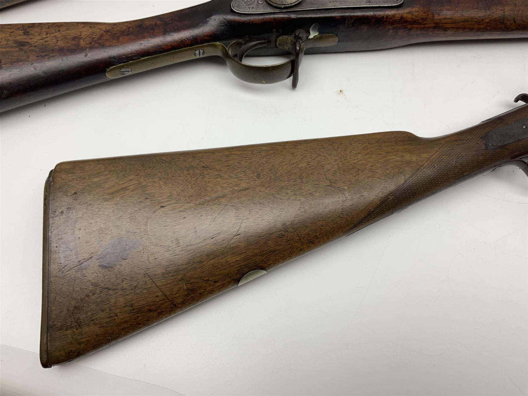 19th century Indian .577 Enfield muzzle loading rifle, proofed for 26-bore, the 98.5cm barrel with three barrel bands and later ram rod L140cm overall; 19th century Belgian side-by-side double barrel percussion shotgun, approximately 20-bore, with 74cm barrels and studded walnut stock, lock plate marked 'Liege 1868' and 'V. Gulikers-Maquinay' L117cm overall; and another side-by-side double barrel shotgun by Smythe with underlever opening (3)