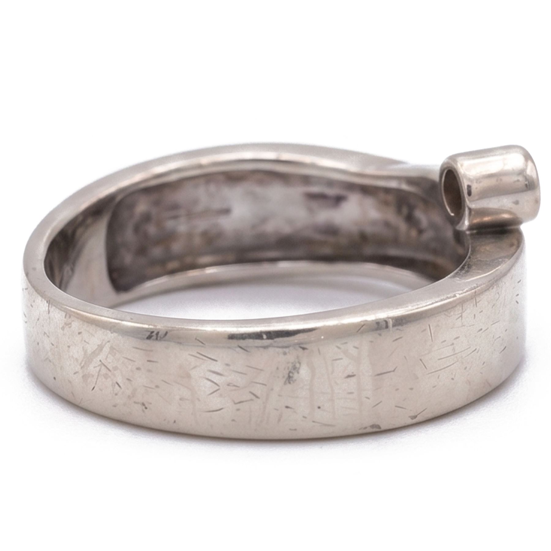 14ct white gold four stone diamond crossover ring, rubover and bezel set with four round cut diamonds, stamped 585
