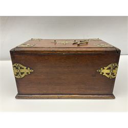 Brass mounted oak humidor, the slide action top opening to a base drawer, cedar lined with central compartment and striker, the drawer stamped Rd 107198, H17cm, D18cm