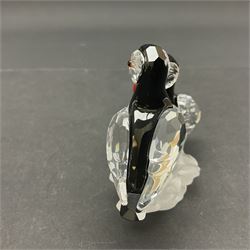 Three Swarovski Crystal bird figures, comprising Toucan, pair of puffins and pair of parrots on a branch, tallest H10cm