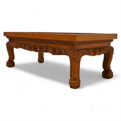 Hardwood rectangular coffee table, carved with trailing branches with foliage and flower heads, on scroll carved cabriole feet 