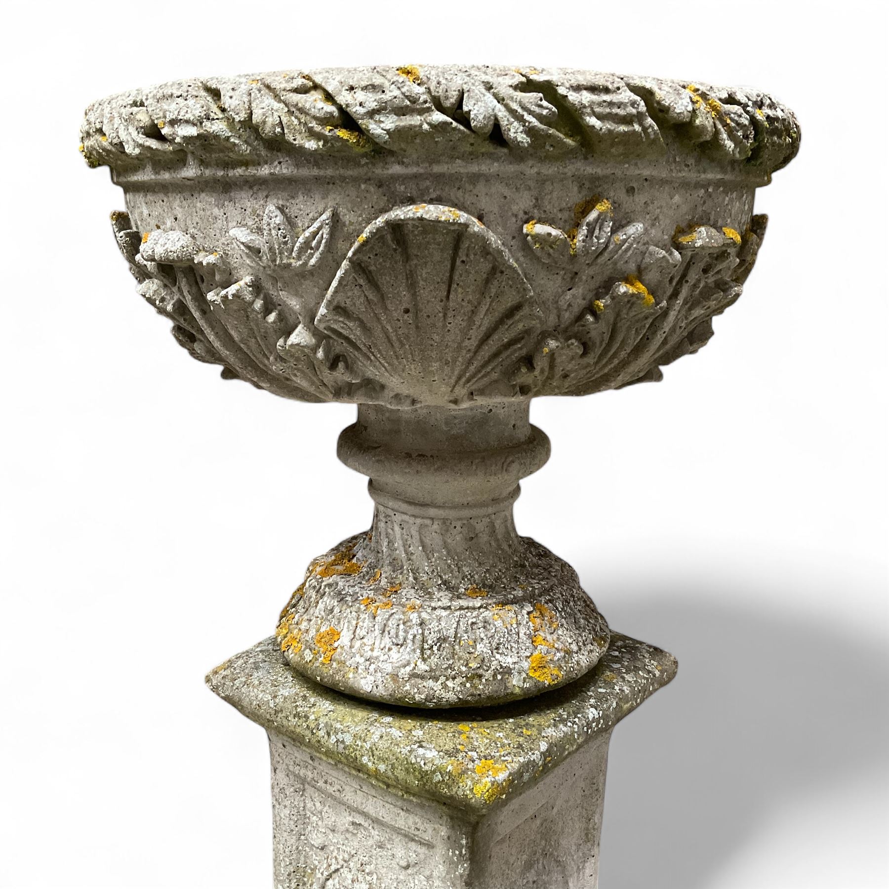 Pair of cast stone ornate garden urns, on plinth bases