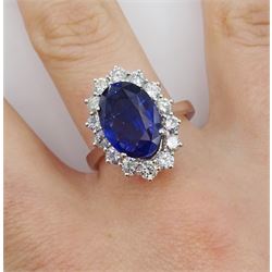 18ct white gold oval fine Ceylon sapphire and round brilliant cut diamond cluster ring, hallmarked, sapphire approx 4.00 carat, total diamond weight approx 0.90 carat