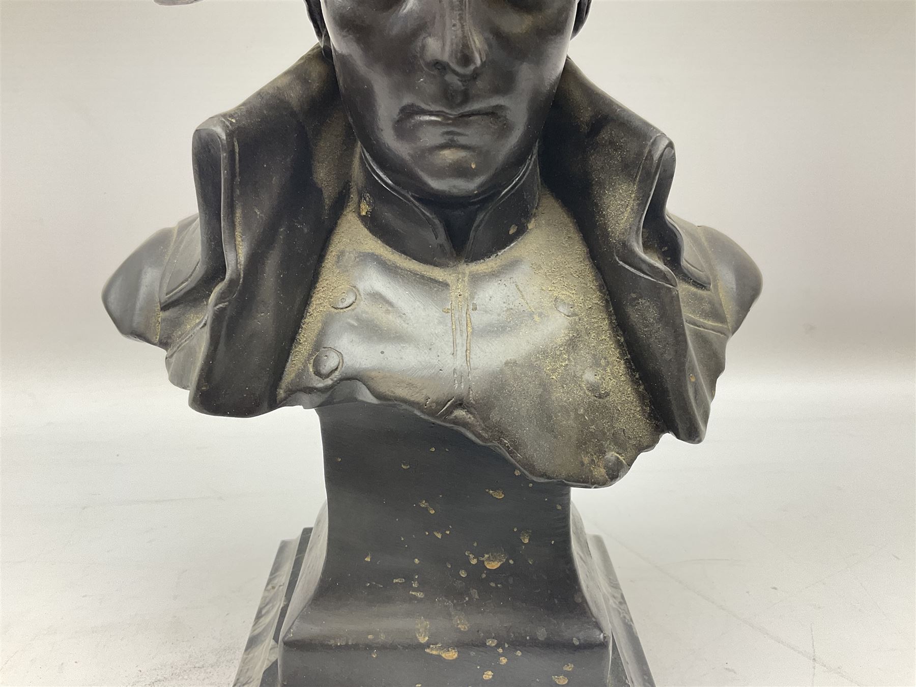 Bronze bust modelled as Napoleon, head and shoulders, wearing his hat and with open collar, on a tapering square section base, marked to the reverse 'Lecomte '82', H36cm