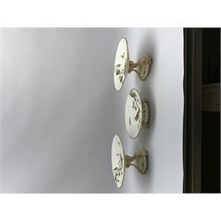 19th century Minton dessert service, comprising four comports, one tazza, and twelve plates, each hand painted with birds perched upon branches, and further detailed with insects and heightened in gilt, with printed retailers mark beneath for John Mortlock Oxford Street London, and impressed Minton mark to most, comport H13.5cm, plates D23.5cm. 
