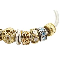 Chamilia 14ct gold and silver charm bracelet, silver bracelet, with 14ct gold and silver finials, six 14ct gold charms including cubic zirconia, four silver charms and two silver and 14ctgold charms, boxed
