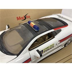 Two Maisto 1:12 scale Jaguar XJ220 scale cars comprising 1992 ‘Concept Car’ West Midlands Police car and 1994 ‘Jag 999’ Thames Valley Police Traffic Car, both on plinths with original boxes and certificates of authenticity 