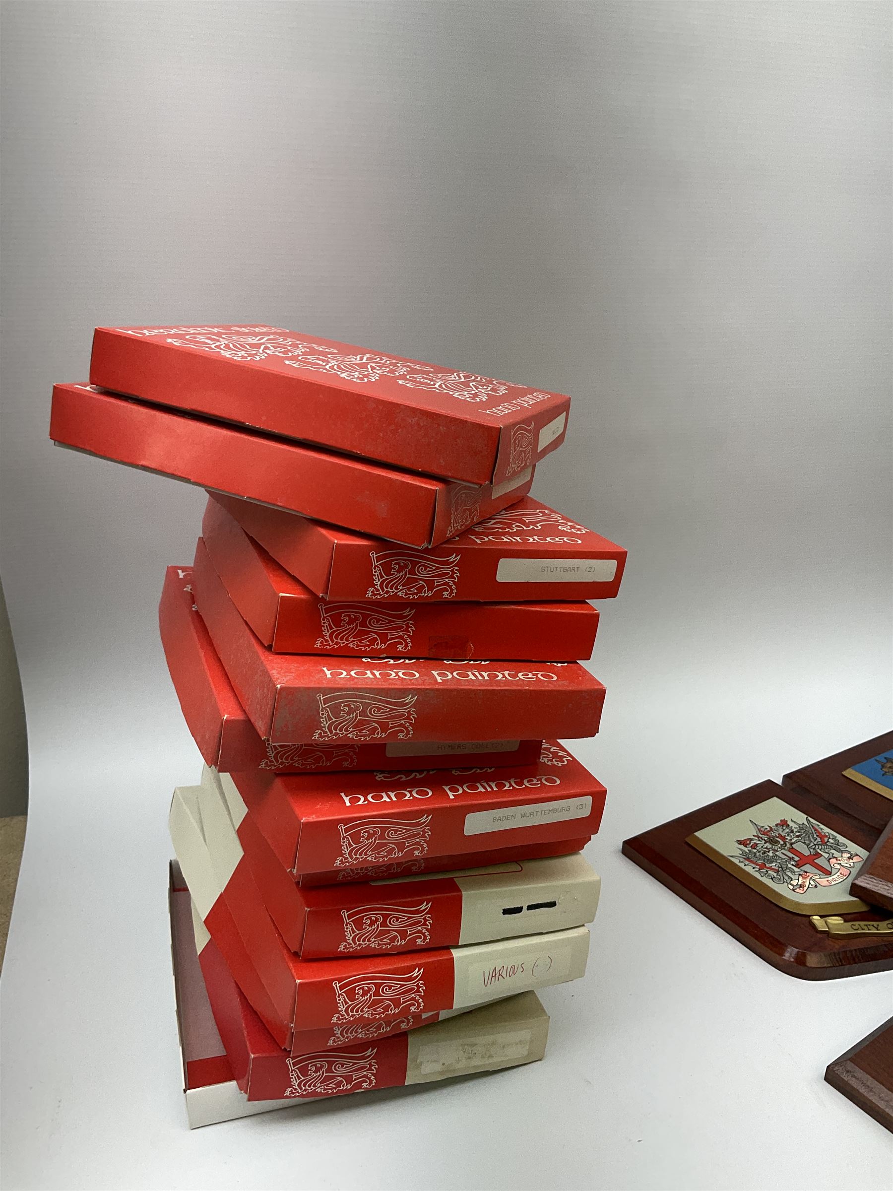 Various European cities and states, wooden heraldic shields each with hand painted raised shield including Baden Wurttemberg, Kunzelsau, City of London, Kingston upon hull etc, seventeen in total. . 