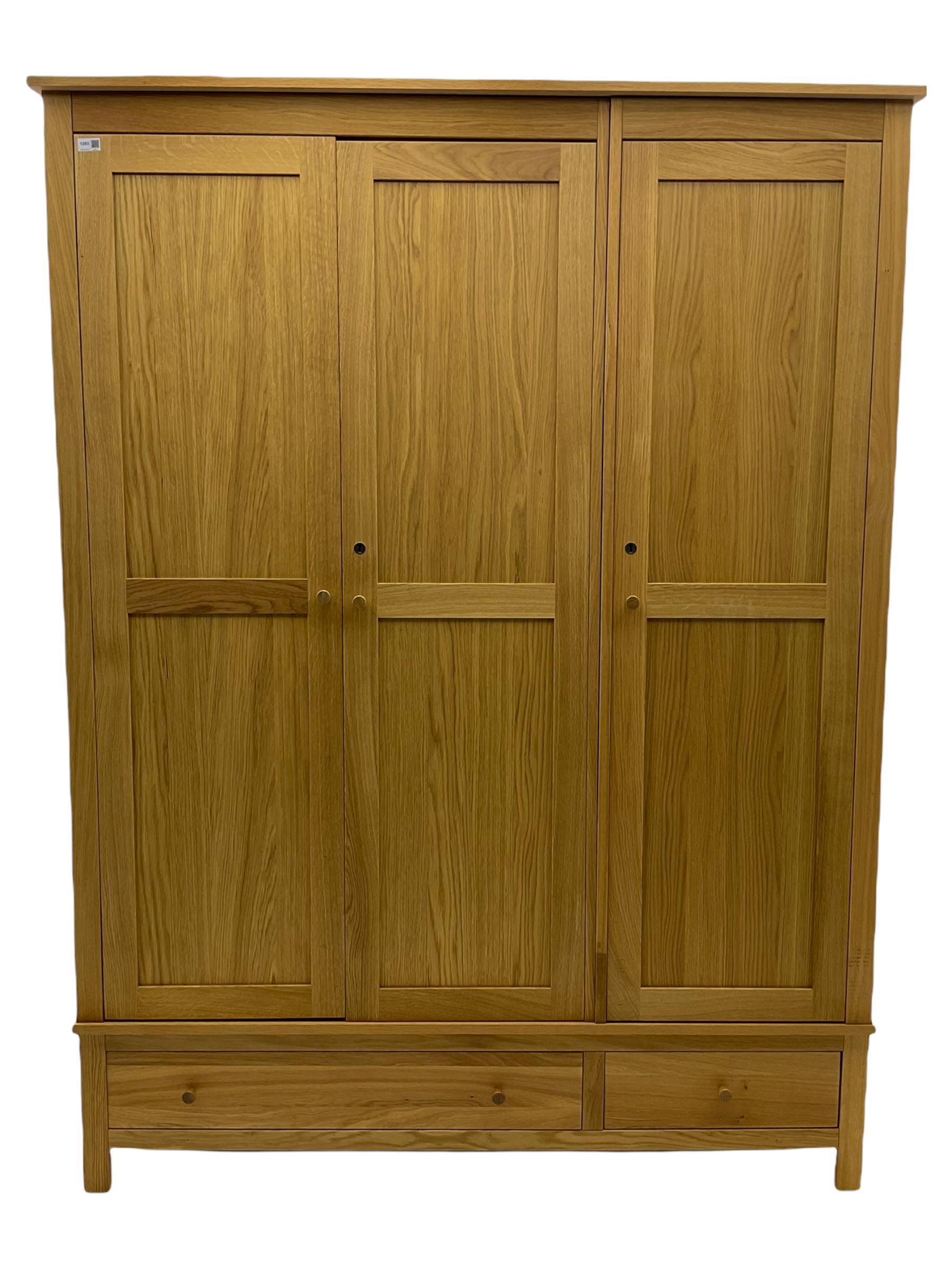 Corndell Furniture - light oak triple wardrobe, enclosed by three panelled doors, one long and one short drawer