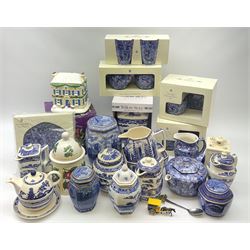 A group of Ringtons teawares, some boxes, to include Willow Story pattern, and Chintz pattern, and a boxed Ringtons novelty tealight house. 