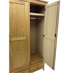 Corndell Furniture - light oak triple wardrobe, enclosed by three panelled doors, one long and one short drawer