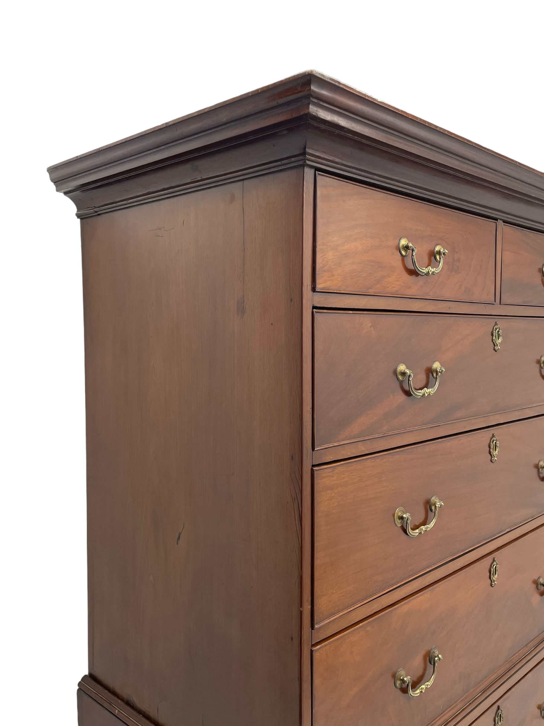 George III figured mahogany chest-on-chest, projecting moulded cornice over two short and six long graduating cock-beaded drawers, on bracket feet