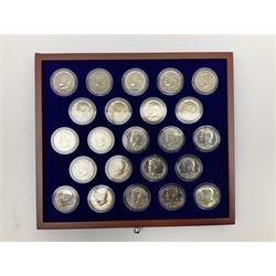 United States of America half dollar coins from 'The John F. Kennedy Uncirculated U.S. Half-Dollar Collection', housed in a display cabinet