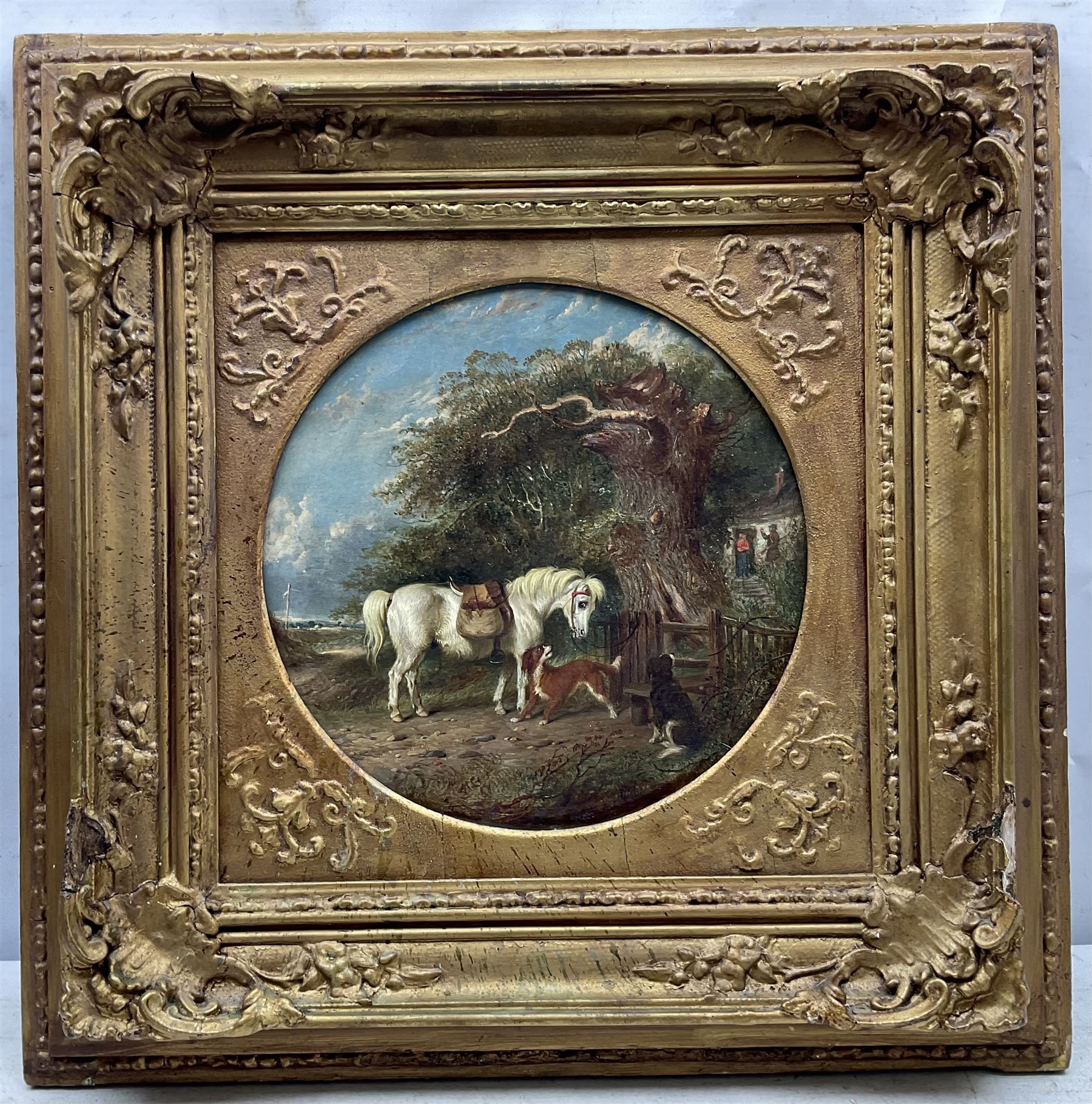 Circle of James Ward RA (British 1769-1859): Pony and Dogs at the Cottage Stile, circular oil on canvas unsigned 30cm diameter